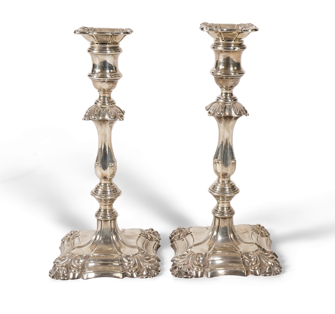 A pair of George V 18th century style silver candlesticks, by Thomas Bradbury & Sons, with removable sconces
